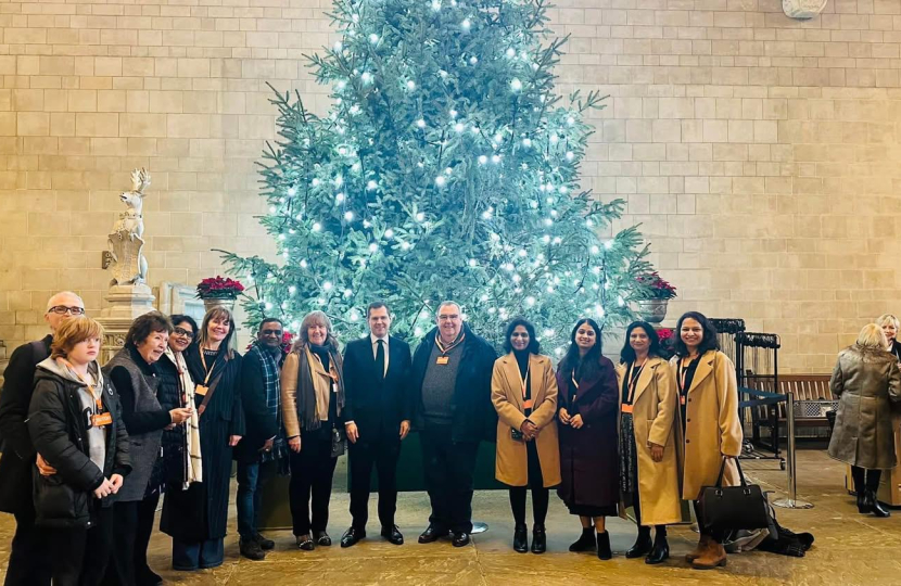 Image of people in front of Christmas Tree in Westminster Hall